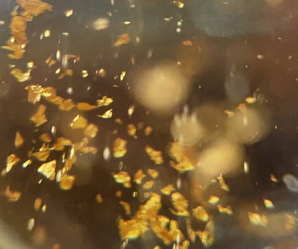 Floating gold flakes image